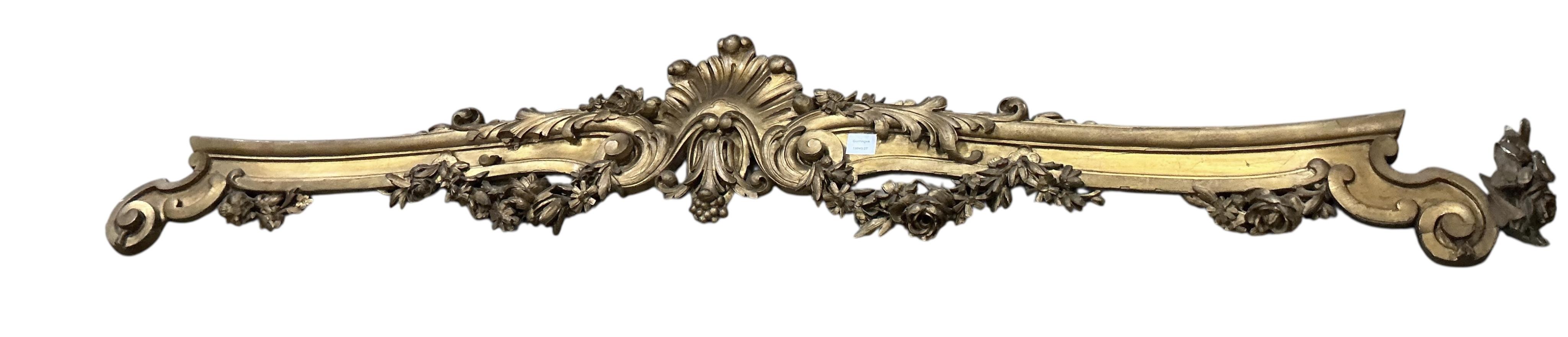 A Victorian carved giltwood pediment, length 200cm